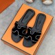 Hermes Oran Black Suede Crystal Sandals Angled View Angled top view of the black slip-on sandals highlighting the crystal-accented cut-out strap details