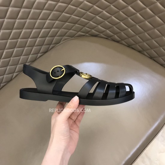 Gucci Black Sandals Outer View in black and gold Handheld angle showing the outer side of the black Gucci sandals in black and gold