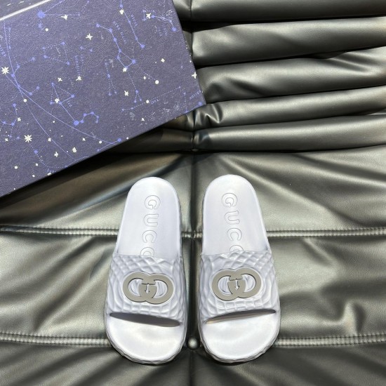 Front overhead view of Gucci grey rubber slide sandals featuring footbed branding Gucci grey rubber slide sandals displayed flat from an overhead perspective