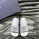 Front overhead view of Gucci grey rubber slide sandals featuring footbed branding Gucci grey rubber slide sandals displayed flat from an overhead perspective