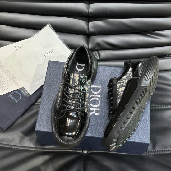 Angled View of Dior Men's Black and Beige Derby Shoes Angled top view of Dior men's black derby shoes displayed on top of a branded blue box with documentation in black and beige